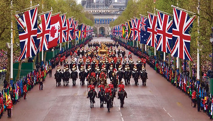 Williamson and the RCMP lead the Coronation Procession from Westminster Abbey to Buckingham Palace.